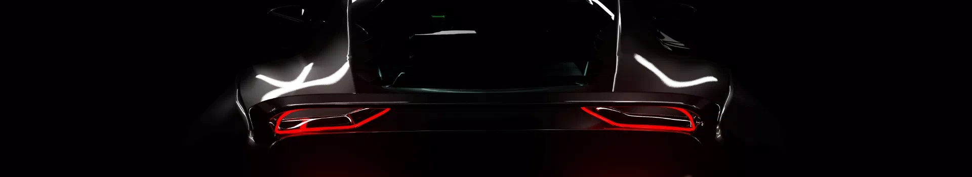 Tył nowoczesnego samochodu na ciemnym tle